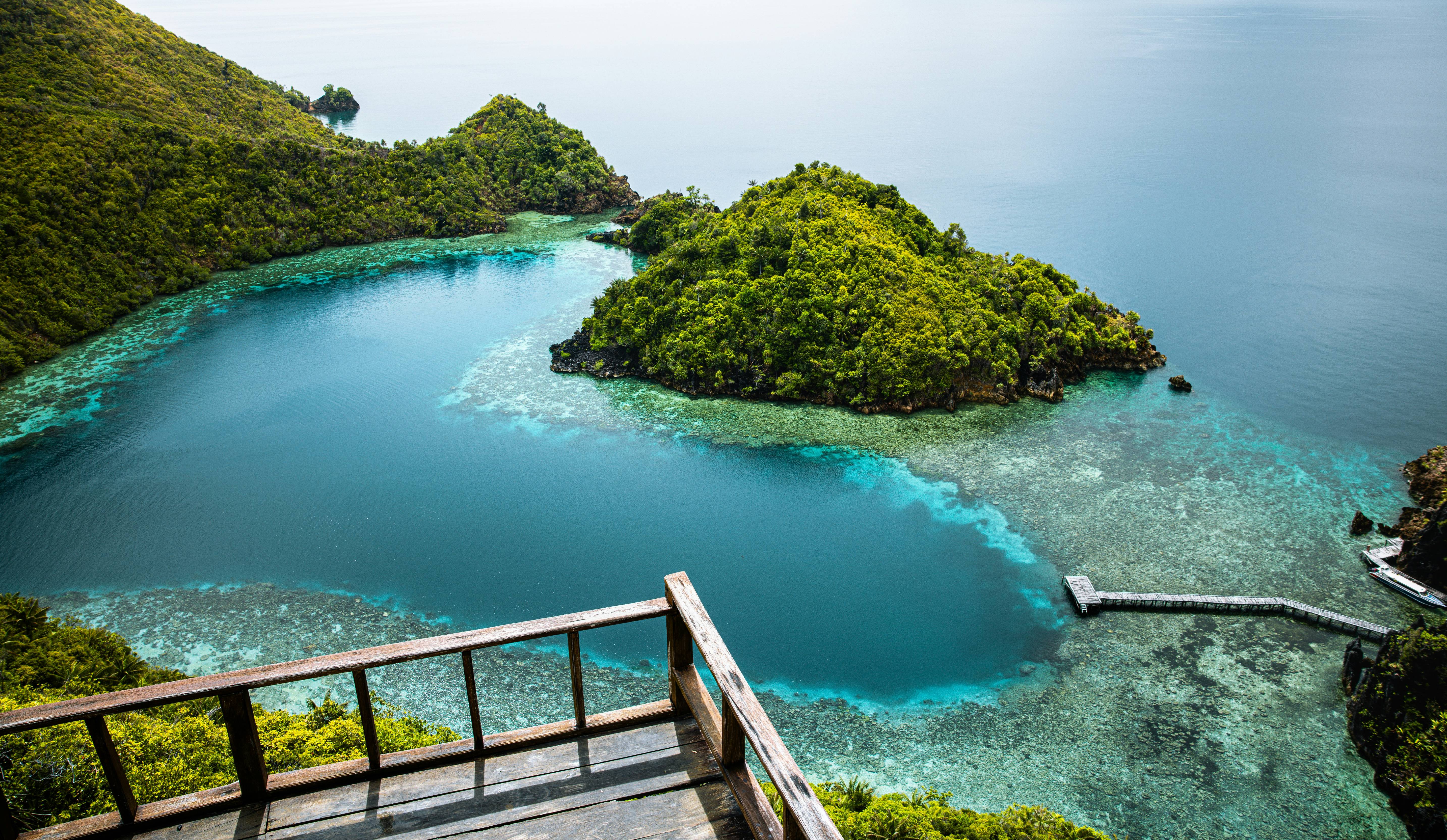 an aerial view of a small island in the middle of the ocean