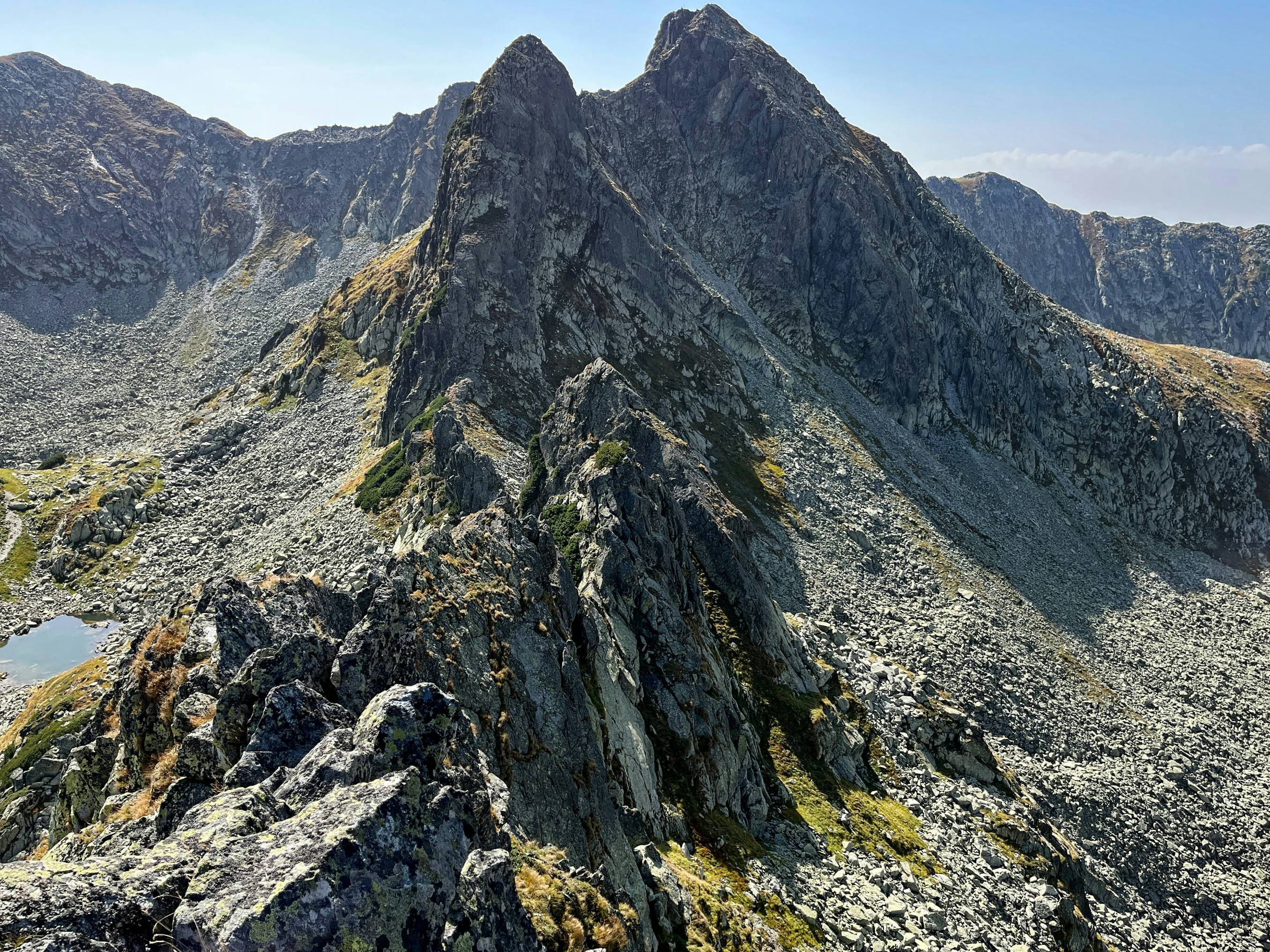 a view of a mountain range from the top of a mountain